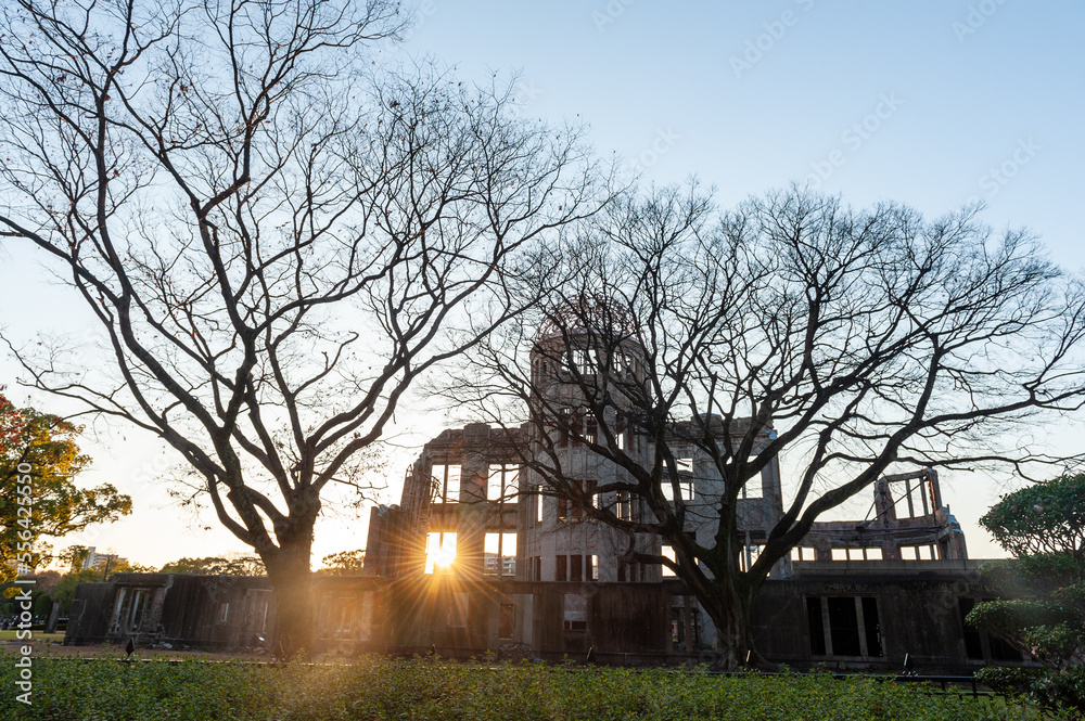 The last rays of the setting sun falling through one of the windows of the historic atomic bomb dome in Hiroshima, Japan on new years day. The last rays of the setting sun falling through one of the windows of the historic atomic bomb dome in Hiroshima, Japan on new years day.