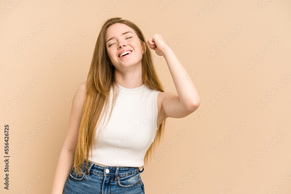 Young redhead woman cut out isolated celebrating a victory, passion and enthusiasm, happy expression. Young redhead woman cut out isolated celebrating a victory, passion and enthusiasm, happy expression.