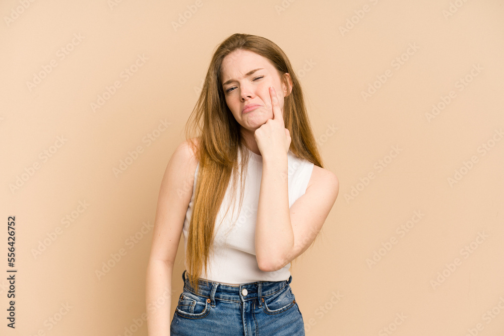 Young redhead woman cut out isolated crying, unhappy with something, agony and confusion concept. Young redhead woman cut out isolated crying, unhappy with something, agony and confusion concept.