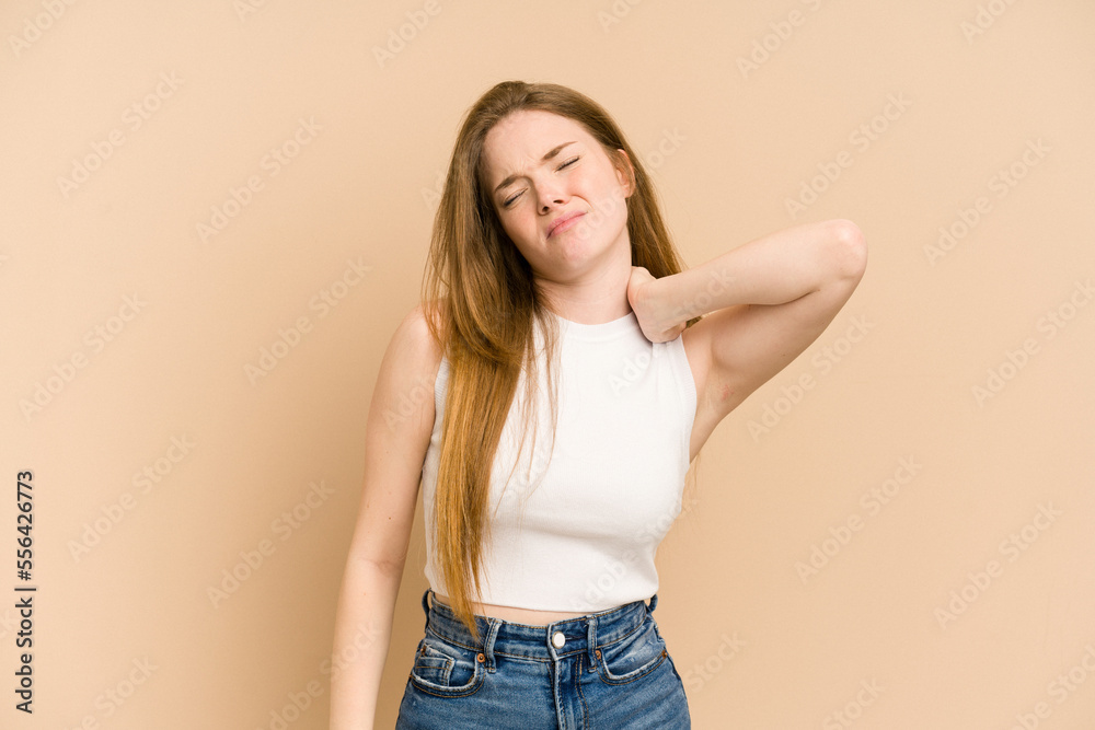 Young redhead woman cut out isolated massaging elbow, suffering after a bad movement.