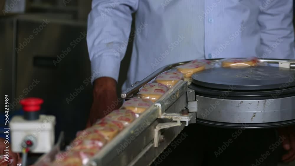 A close view of wrapped soaps carried on conveyor belt A close view of wrapped soaps carried on conveyor belt