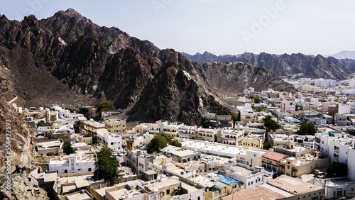 view of the city and the rocky mountains of Hajar