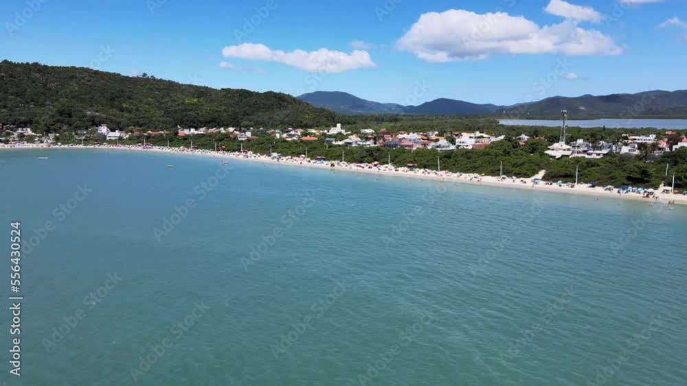 Aerial drone scene of houses on the beach seen from above high standard houses facing the sea in florianopolis daniela beach with turquoise blue sea and lots of nature Aerial drone scene of houses on the beach seen from above high standard houses facing the sea in florianopolis daniela beach with turquoise blue sea and lots of nature
