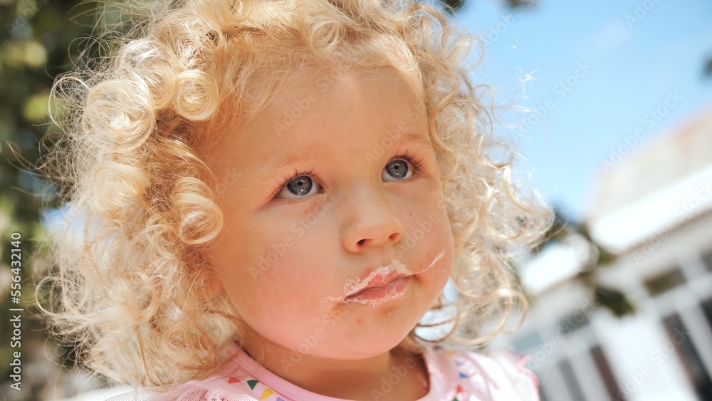 Portrait of a funny girl with leftover cream from a cake. Portrait of a funny girl with leftover cream from a cake.