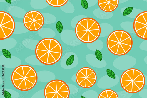 A pattern of slices of oranges and green leaves on a spotted background.