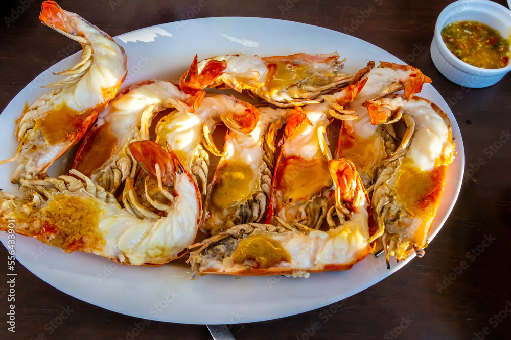Grilled river prawns or shrimp on white dish in restaurant. Grilled river prawns or shrimp on white dish in restaurant.