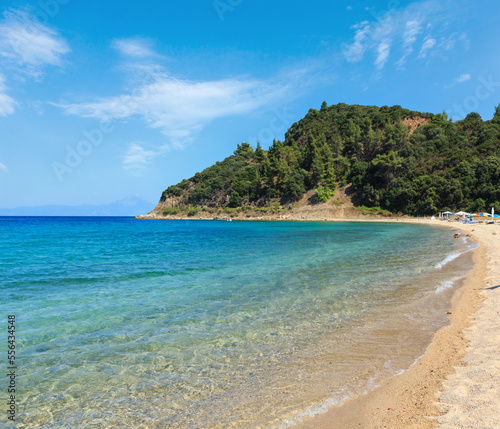 Aegean sea coast landscape, view from sandy beach (Chalkidiki, Greece). Peoples unrecognizable. © wildman
