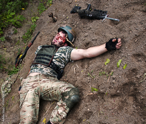 Canvas Print Wounded soldier lie on the battlefield