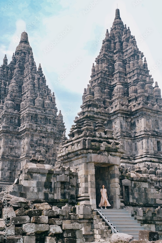 vertical model posing at prambanan temple, yogyakarta, indonesia