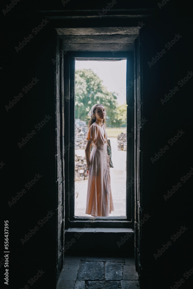 vertical model posing at prambanan temple, yogyakarta, indonesia