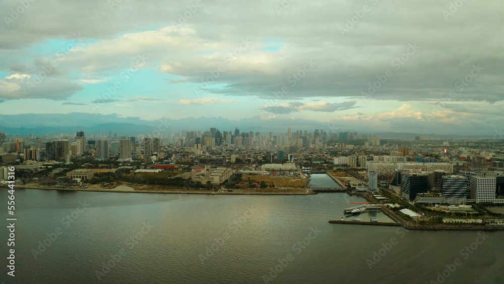 Cityscape of Makati, the business center of Manila, view from above. Asian metropolis at sunset. Travel vacation concept.