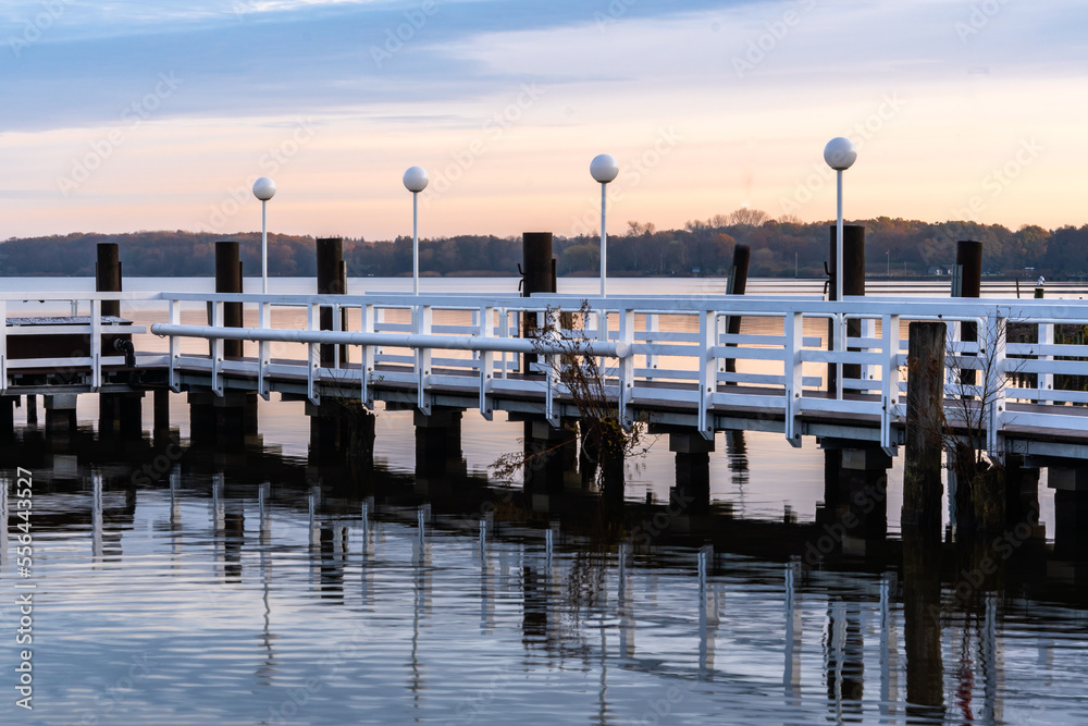 Fototapeta premium Photos of a picturesque autumn park on the lake in Lower Saxony, Germany. Dawn in the park.
