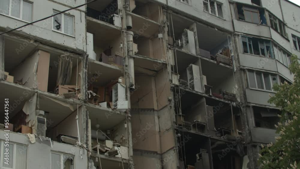 Collapsed block of flats, result of russian missile attack on Ukrainian citizens. Residential building with no walls, large holes in apartments caused by russian rockets. Kharkiv 25.05.2022 Collapsed block of flats, result of russian missile attack on Ukrainian citizens. Residential building with no walls, large holes in apartments caused by russian rockets. Kharkiv 25.05.2022