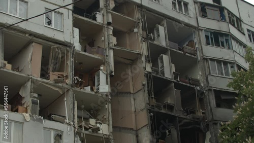 Collapsed block of flats, result of russian missile attack on Ukrainian citizens. Residential building with no walls, large holes in apartments caused by russian rockets. Kharkiv 25.05.2022 photo