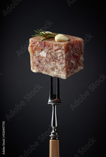 Headcheese on a fork.