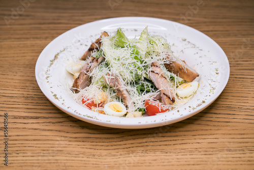 Restaurant dish - caesar salad with fried chicken