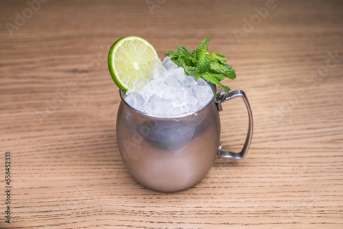 Alcoholic cocktail on wooden board