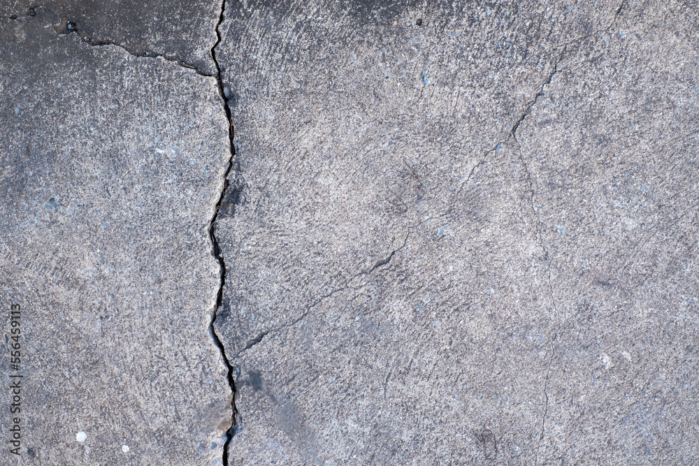 Fototapeta premium Cracked concrete wall broken wall at the outside cement corner that effected with earthquake and collapsed ground