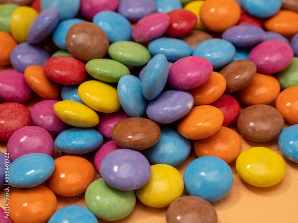 Small multi-colored round candies. Sweets covered with sugar icing. Small multi-colored round candies. Sweets covered with sugar icing.
