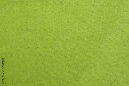 Texture natural light green cotton or linen fabric as background. Texture textile cloth