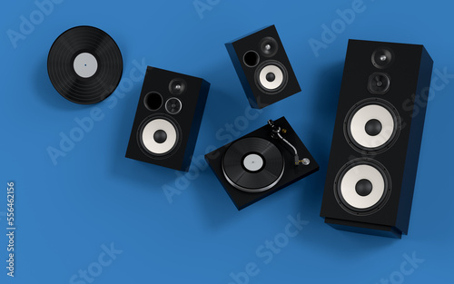 Set of Hi-fi speakers and DJ turntable for sound recording studio on blue.
