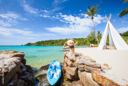 Young Asian lady tourist on the beach  at the tropical sea. Trat Province, Thaiand. photo