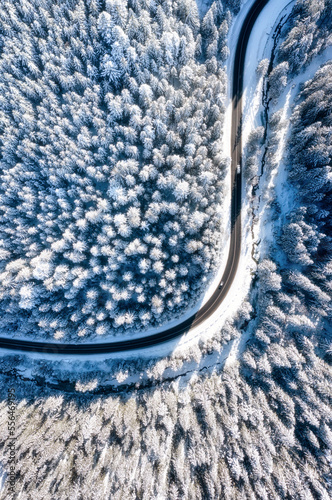 Aerial view on the road and forest at the winter time. © biletskiyevgeniy.com