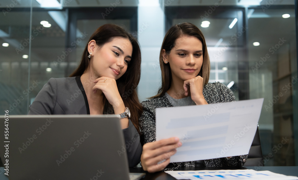 Both of young female entrepreneurs. Is exchanging ideas with new work that is going to be presented to executive management for approval. Both of young female entrepreneurs. Is exchanging ideas with new work that is going to be presented to executive management for approval.