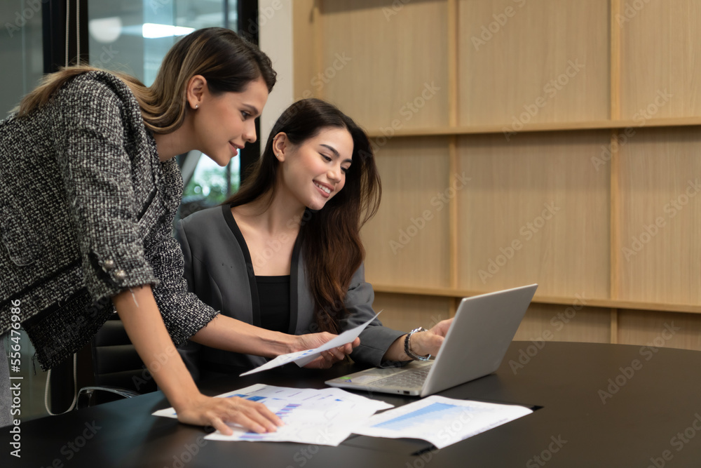 Both of young female entrepreneurs. Is exchanging ideas with new work that is going to be presented to executive management for approval. Both of young female entrepreneurs. Is exchanging ideas with new work that is going to be presented to executive management for approval.