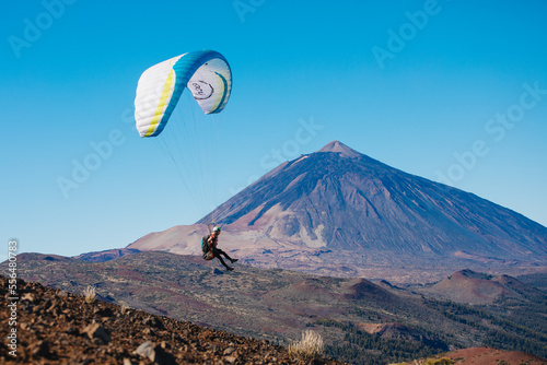 Paragliding in Tenerife from the volcano through the clouds. Teide