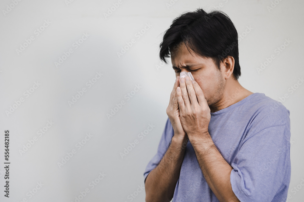 portrait Asian man coughing and sneezing portrait Asian man coughing and sneezing