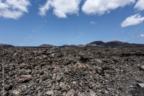 Bizarre volcanic landscape of Timanfaya National Park with black lava fields, Lanzarote, Canary Islands