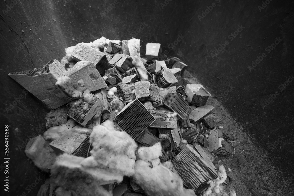 Black and white. Filter of harmful emissions, catalyst from the vehicle. detail close up view. Material containing precious metals. Muffler of the exhaust system. Vertical photo