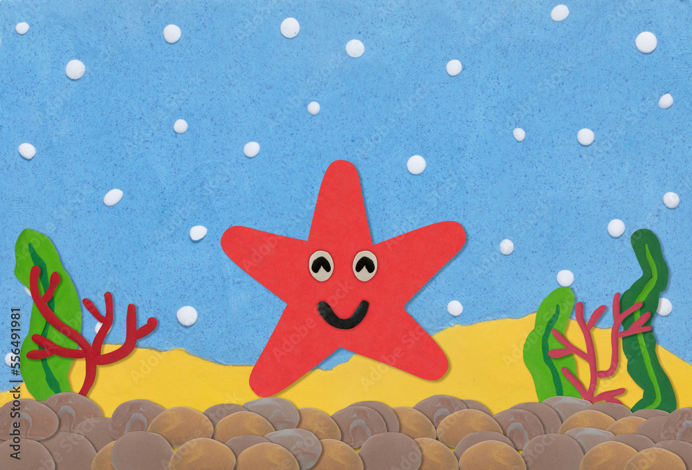Fototapeta premium red star fish made from plasticine on under water background