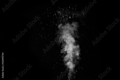 A white curly steam with a spray of drops rising up is isolated on a black background to overlay your photos