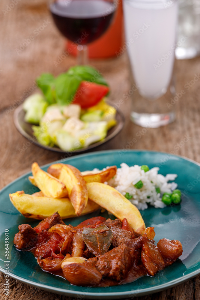 greek stifado meat stew with fries greek stifado meat stew with fries