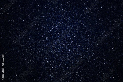 Deep space with myriads of stars of different luminosity. Background with outer space dotted with many stars.