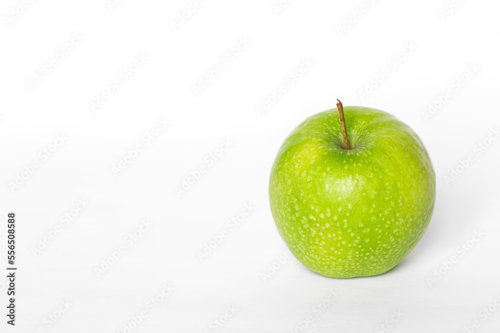 Green apple on a white background isolated, copy space. Green apple on a white background isolated, copy space.