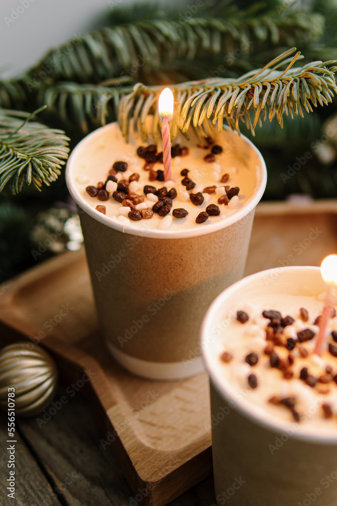 Two small chocolate cakes in paper cups. Natural. Cake to go. Treat for New Year or Christmas. Cake with candles. Birthday cake Two small chocolate cakes in paper cups. Natural. Cake to go. Treat for New Year or Christmas. Cake with candles. Birthday cake