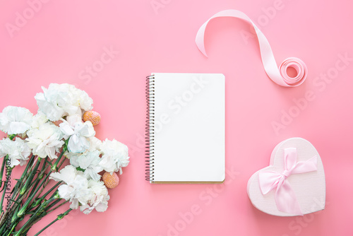 Blank notepad, flower and heart shaped gift box, flat lay. © puhimec