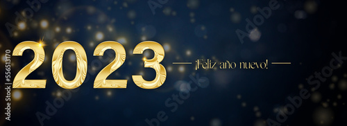 Banner elegante de Feliz Año Nuevo 2023 con letras doradas sobre fondo azul con destellos en horizontal 