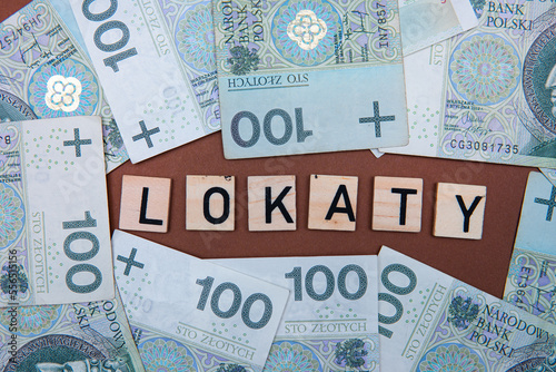 Inscription Lokaty which means Deposits next to Polish Money. 