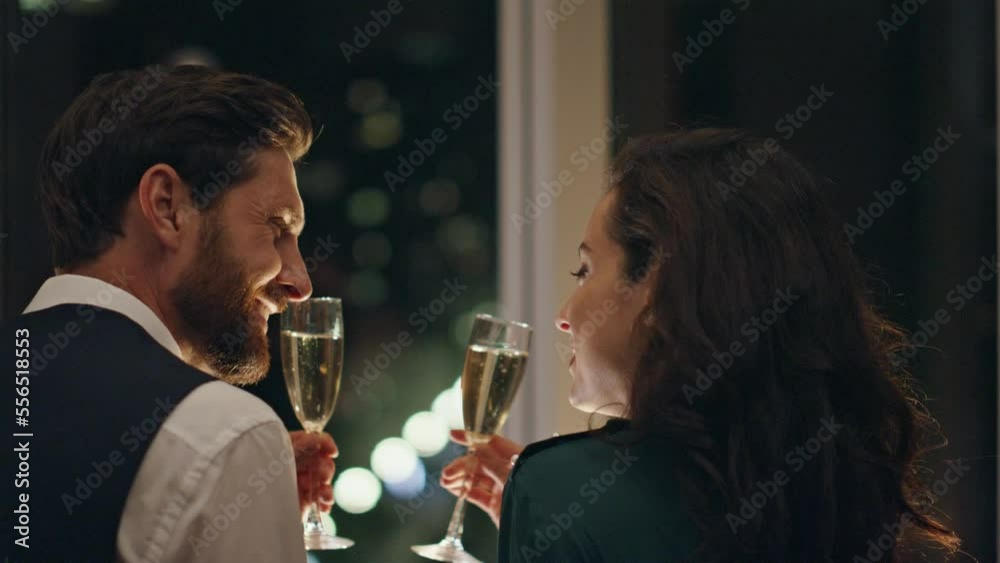 Happy pair love drinking champagne enjoying night city view closeup. Couple date Happy pair love drinking champagne enjoying night city view closeup. Couple date
