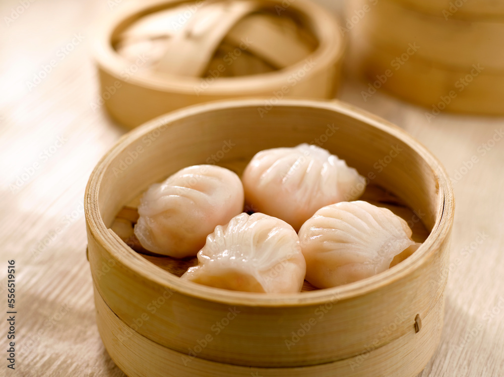Steamed Prawn Dumpling Ha Kau served in dish isolated on table top view of food Steamed Prawn Dumpling Ha Kau served in dish isolated on table top view of food