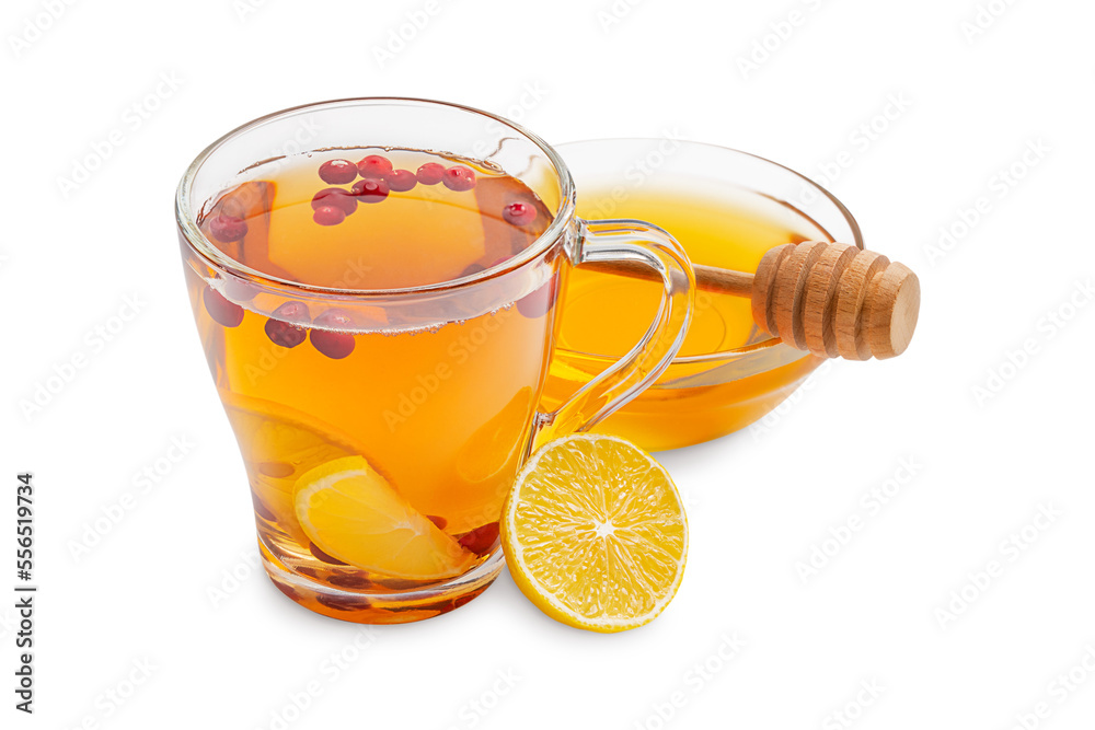 Hot natural organic antioxidant tea made with cranberries, lemon citrus slices and sweet healthy honey served in transparent glass cup with ingredients isolated on white background used in winter Hot natural organic antioxidant tea made with cranberries, lemon citrus slices and sweet healthy honey served in transparent glass cup with ingredients isolated on white background used in winter