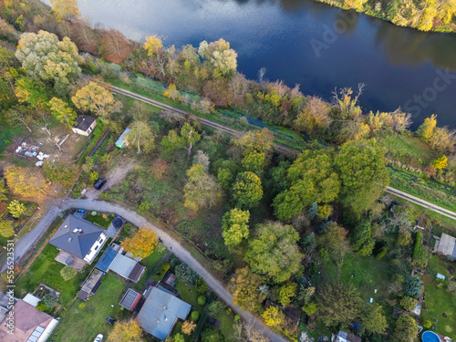 Aerial view of the countryside in Storkow with the Storkower canal, houses and fields © TambolyPhotodesign