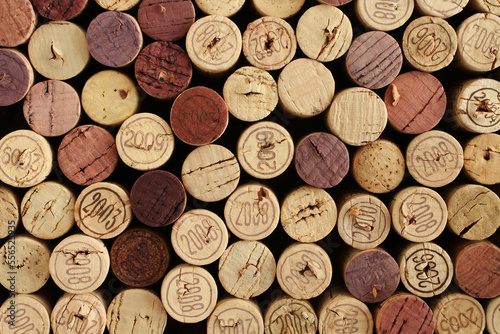 Cork wine bottle tops with numbers of years arranged tightly each other