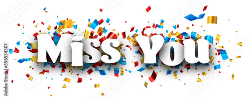 Miss you sign over colorful cut ribbon confetti background.