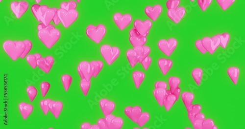 pink 3d hearts are dropping and spin down with green screen