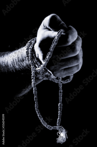 hand with prayer beads photo